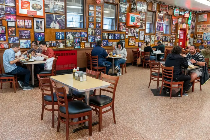 Tables are spaced allowing for proper social distancing as customers enjoy lunch at Katz's Delicatessen.
